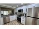 Remodeled kitchen with granite counter tops and stainless appliances at 6177 Sun Blvd # 108, St Petersburg, FL 33715