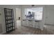 This charming kitchen features stone counter tops and bar seating at 6177 Sun Blvd # 108, St Petersburg, FL 33715