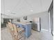 Well-equipped kitchenette featuring bar seating, stainless steel refrigerator, and microwave, perfect for entertaining guests at 6177 Sun Blvd # 108, St Petersburg, FL 33715