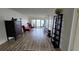 Open living space boasts wood floors, comfortable seating and water views at 6177 Sun Blvd # 108, St Petersburg, FL 33715