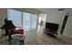 Open-concept living room with wood floors and comfortable seating areas at 6177 Sun Blvd # 108, St Petersburg, FL 33715