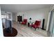 Bright living room with neutral walls, wood floors, and comfortable red seating at 6177 Sun Blvd # 108, St Petersburg, FL 33715