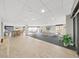 Spacious lounge with multiple seating areas, including tables, chairs, and a refreshment station for relaxing gatherings at 6177 Sun Blvd # 108, St Petersburg, FL 33715