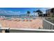 Community swimming pool and lounge area featuring an intercoastal view and a brick deck at 6177 Sun Blvd # 108, St Petersburg, FL 33715