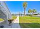 Lush backyard leading to a private boat dock on the water at 644 Bayshore Dr, Tarpon Springs, FL 34689
