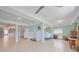 Huge open basement with tiled floors, ceiling fans and a separate laundry room at 644 Bayshore Dr, Tarpon Springs, FL 34689