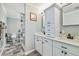 Bright bathroom featuring dual vanity, recessed lighting, glass shower door, and designer fixtures at 644 Bayshore Dr, Tarpon Springs, FL 34689