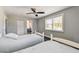 This bedroom includes two twin beds, closet, ceiling fan and an ensuite bathroom at 644 Bayshore Dr, Tarpon Springs, FL 34689