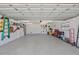 This garage features epoxy flooring, a storage system, and bright lighting at 644 Bayshore Dr, Tarpon Springs, FL 34689