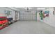 Spacious garage features epoxy flooring, ample storage, and great natural light at 644 Bayshore Dr, Tarpon Springs, FL 34689