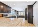 A sleek kitchen features stainless appliances, wood floors, and wood cabinets at 644 Bayshore Dr, Tarpon Springs, FL 34689