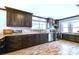 A modern kitchen features wood floors, wood cabinets, and stainless steel appliances at 644 Bayshore Dr, Tarpon Springs, FL 34689
