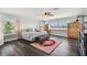 A spacious main bedroom featuring hardwood floors, natural light, ceiling fan, and a large window view at 644 Bayshore Dr, Tarpon Springs, FL 34689