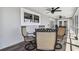 Covered patio includes ceiling fans and outdoor table with chairs at 644 Bayshore Dr, Tarpon Springs, FL 34689