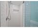 Shower stall tiled in white subway tile features a built in shelf at 644 Bayshore Dr, Tarpon Springs, FL 34689