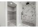 Spa-like bathroom with walk-in shower and marble tile at 211 Dolphin Pt # 203, Clearwater, FL 33767