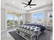 Spacious bedroom with water views and access to a balcony at 211 Dolphin Pt # 203, Clearwater, FL 33767