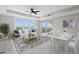 Bright living room with water views, comfy seating, and dining area at 211 Dolphin Pt # 203, Clearwater, FL 33767