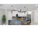 Modern kitchen with island, stainless steel appliances, and white cabinetry at 211 Dolphin Pt # 203, Clearwater, FL 33767