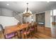 Bright dining room with a large wooden table and chandelier at 2316 Kent Pl, Clearwater, FL 33764