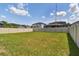 Large grassy backyard with a privacy fence at 12235 Creek Preserve Dr, Riverview, FL 33579