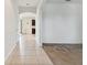 Bright and spacious entryway with tile flooring and views to the living room at 12235 Creek Preserve Dr, Riverview, FL 33579