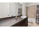 Bathroom features a tub shower combo and dark vanity at 12235 Creek Preserve Dr, Riverview, FL 33579