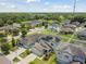 Aerial view of house with solar panels and neighborhood at 12235 Creek Preserve Dr, Riverview, FL 33579