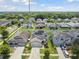Aerial view of home with solar panels in a community at 12235 Creek Preserve Dr, Riverview, FL 33579