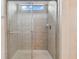 Clean shower with glass enclosure and neutral tile at 12235 Creek Preserve Dr, Riverview, FL 33579