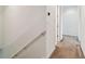 Upstairs hallway with carpet and neutral walls at 12235 Creek Preserve Dr, Riverview, FL 33579