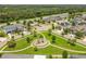 Aerial view of a residential neighborhood with a playground and homes at 12235 Creek Preserve Dr, Riverview, FL 33579