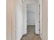 Clean hallway with neutral carpeting and access to bedrooms at 12235 Creek Preserve Dr, Riverview, FL 33579