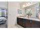Bathroom with double vanity and view into bedroom at 12235 Creek Preserve Dr, Riverview, FL 33579
