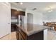 Kitchen with island and granite countertops, open to dining area at 12235 Creek Preserve Dr, Riverview, FL 33579