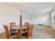 Dining area with a round wooden table and four chairs at 12235 Creek Preserve Dr, Riverview, FL 33579