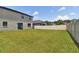 Large grassy backyard with a privacy fence at 12235 Creek Preserve Dr, Riverview, FL 33579