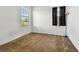 Well-lit bedroom with window, floor lamp, and neutral carpeting at 12235 Creek Preserve Dr, Riverview, FL 33579