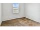 Bright bedroom featuring a window with blinds and neutral carpeting at 12235 Creek Preserve Dr, Riverview, FL 33579