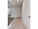 Clean and simple hallway with tile flooring at 12235 Creek Preserve Dr, Riverview, FL 33579