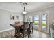 Dining area with a wooden table and chairs, and access to a patio at 644 Bayshore Dr, Tarpon Springs, FL 34689