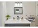 Double vanity bathroom with gray cabinets and white countertops at 644 Bayshore Dr, Tarpon Springs, FL 34689