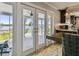 French doors open to a screened patio overlooking the water at 644 Bayshore Dr, Tarpon Springs, FL 34689