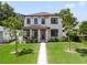 Stunning two-story home with manicured lawn and brick walkway at 160 26Th N Ave, St Petersburg, FL 33704