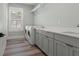 Functional laundry room with washer, dryer, and ample counter space at 160 26Th N Ave, St Petersburg, FL 33704