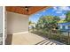 A spacious balcony with wood ceiling, iron railings, and neighborhood views at 705 W Amelia Ave, Tampa, FL 33602