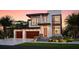 Stunning modern home with a two-car garage, and a beautiful stone accents, providing curb appeal at 705 W Amelia Ave, Tampa, FL 33602