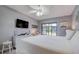 Main bedroom with a king-size bed and sliding door to the patio at 1730 Manasota Beach Rd # 115, Englewood, FL 34223