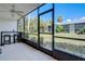 Screened-in patio with outdoor seating and a view of the lawn at 1730 Manasota Beach Rd # 115, Englewood, FL 34223