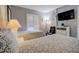 Main bedroom with king-size bed and private balcony access at 1730 Manasota Beach Rd # 115, Englewood, FL 34223